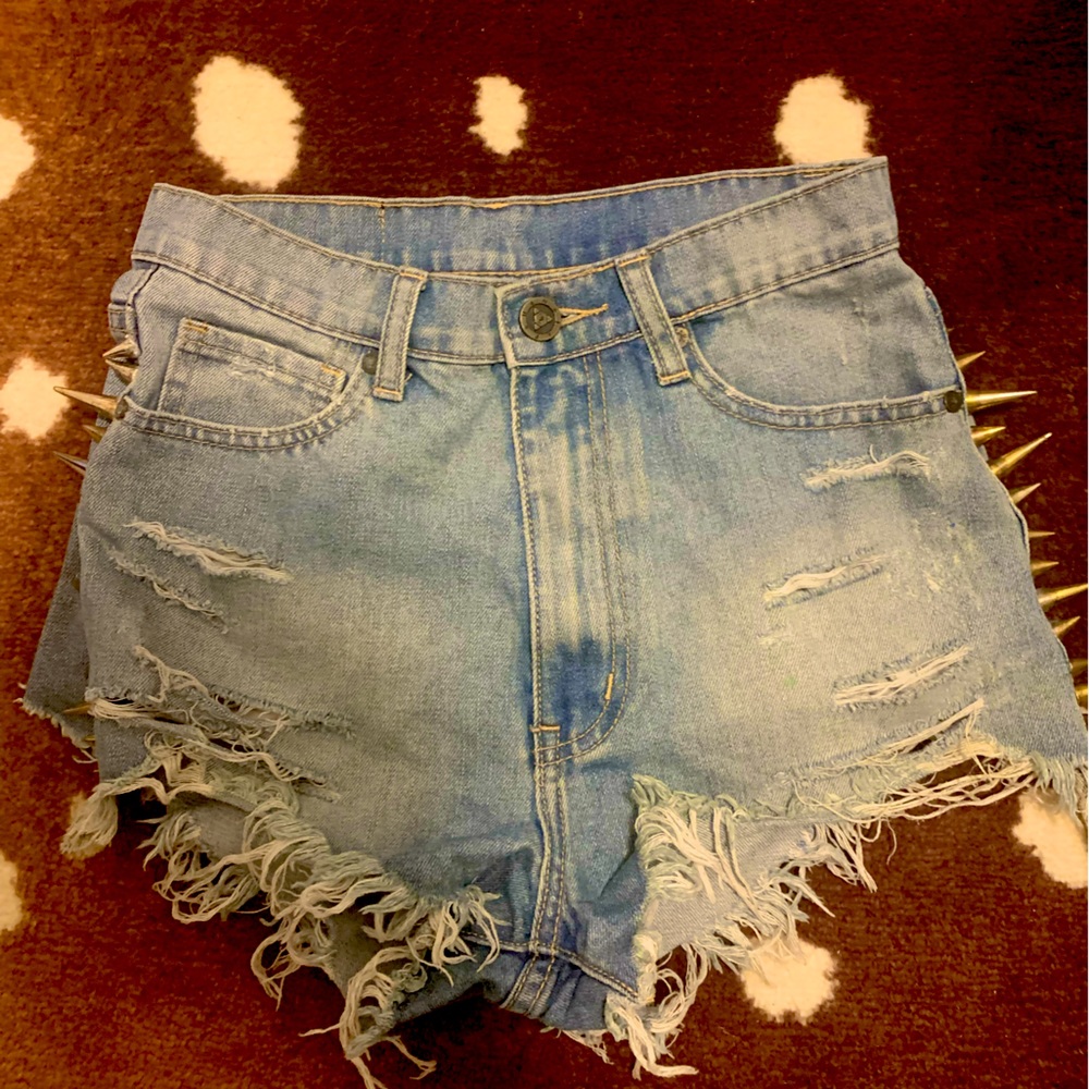Unif high waisted cut off spiked shorts.